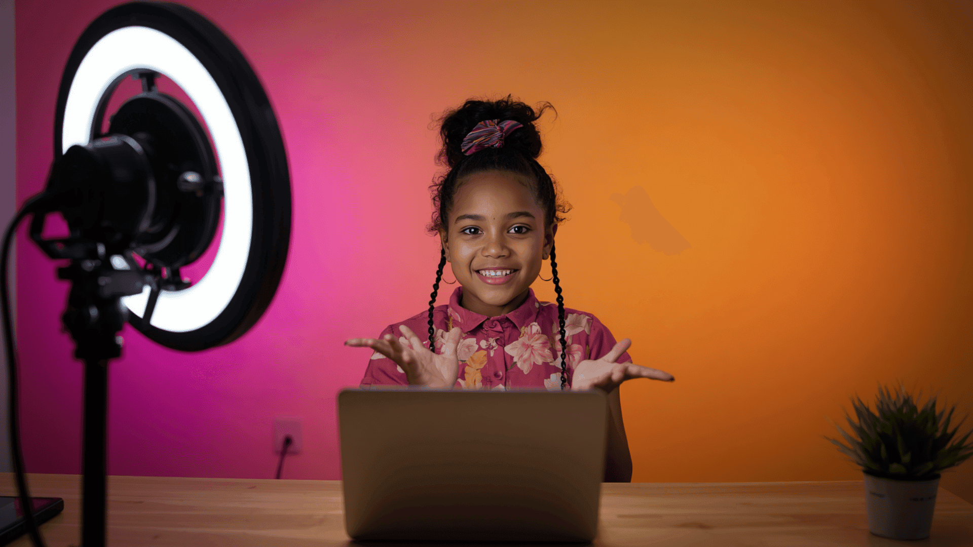  Image Suggestion: A kid recording a video tutorial at a desk with ring light and colorful backgroun